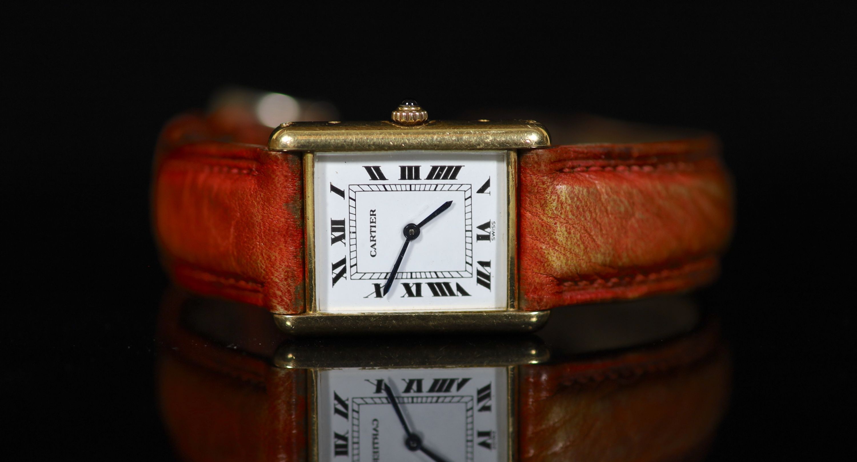 A lady's 18ct gold Cartier Tank Louis quartz wrist watch, on a leather strap